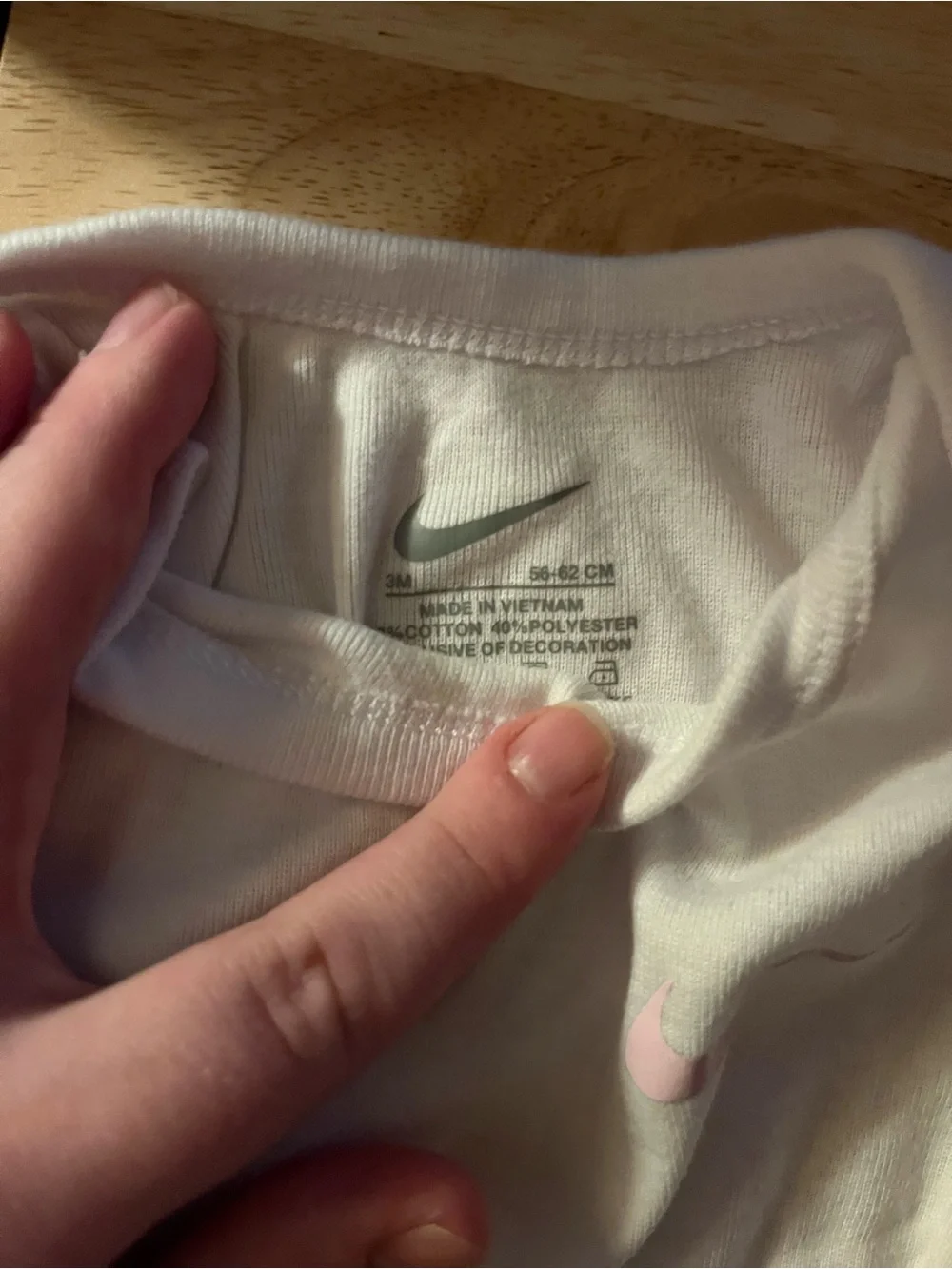 Nike White Baby One-Piece Bodysuit with Pink Swoosh